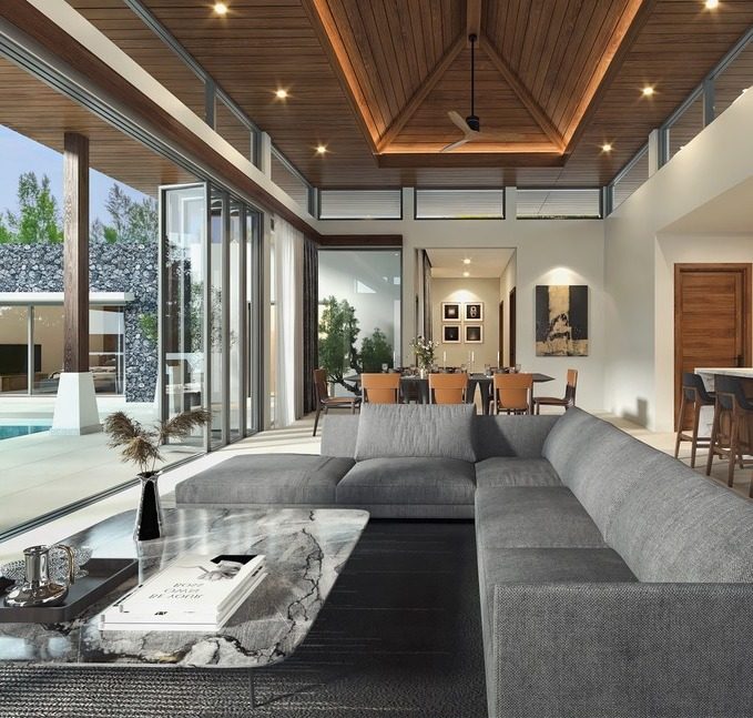 Botanica Four Seasons — living room with a grey sectional sofa and a wooden ceiling