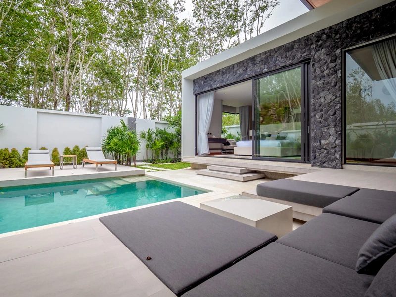 Botanica Four Seasons — pool terrace with sun loungers in a Modern Loft villa