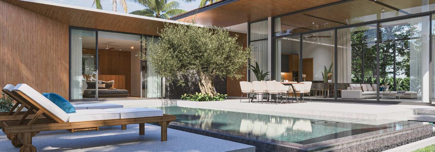 Botanica Four Seasons — villa terrace with a sun lounger and dining area by the pool