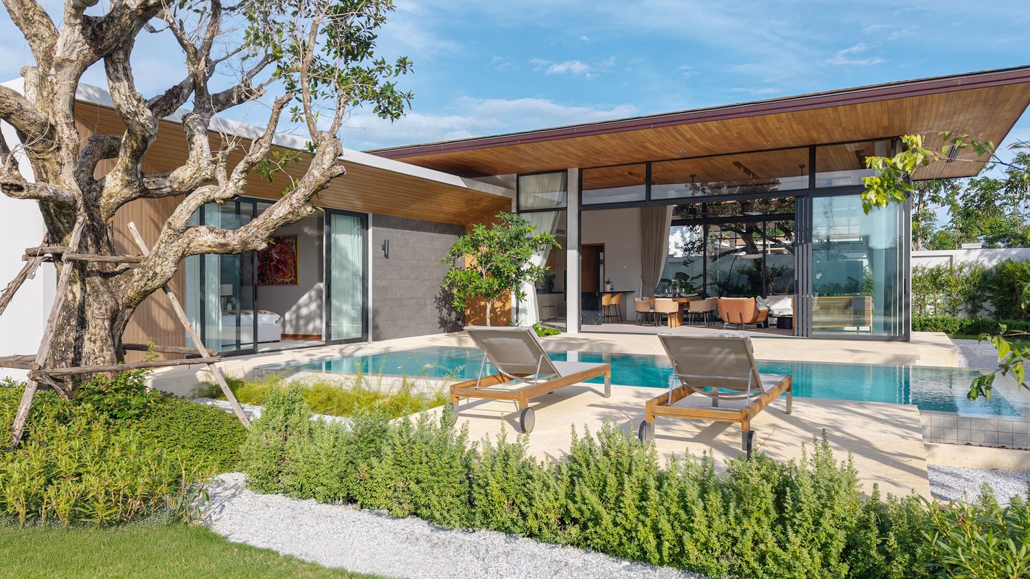 Botanica Four Seasons — Modern Zen villa with a pool and a spreading tree in the garden